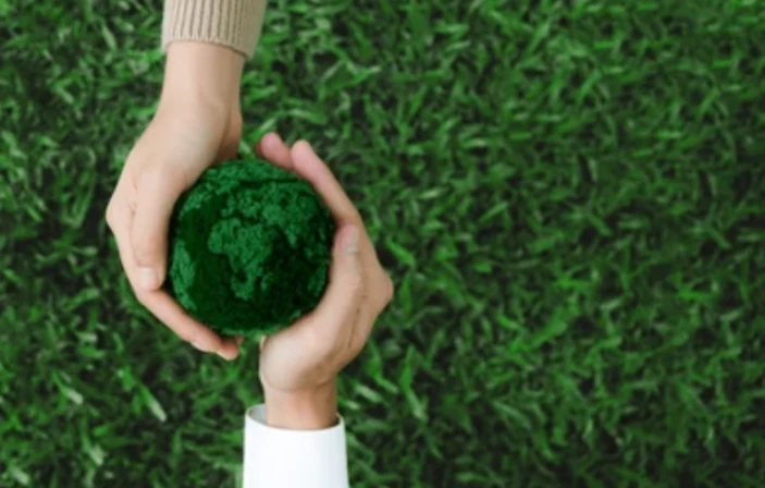 two-hands-holding-green-earth-260nw-2473821271